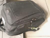 BLACK BACKPACK WITH  A Samsung Galaxy Tab S9 tablet